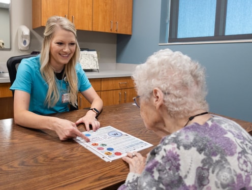 A speech therapist working with a patient.