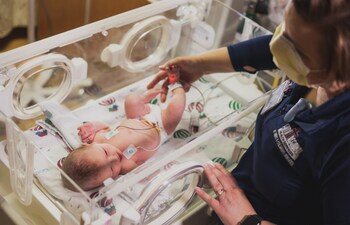 A Faith Regional nurse caring for a baby in our NICU.