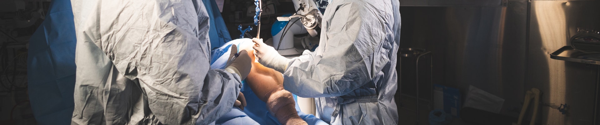 Two surgeons performing a leg surgery