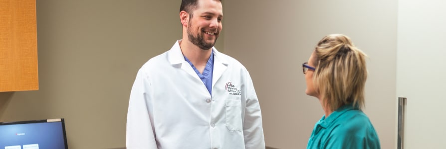 Dr. Laudenklos, an OB/GYN, speaking to a patient.