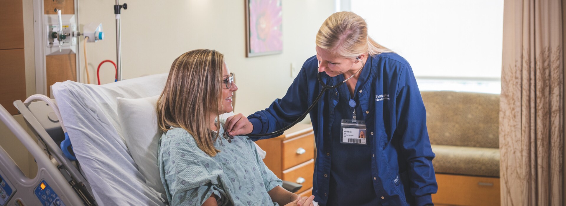 Grateful patient and nurse in hospital room