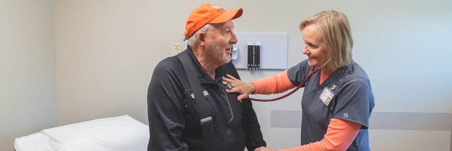 Jean Suehl, APRN, examining her patient.