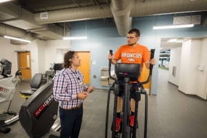 A physical therapy assistant working with a patient.