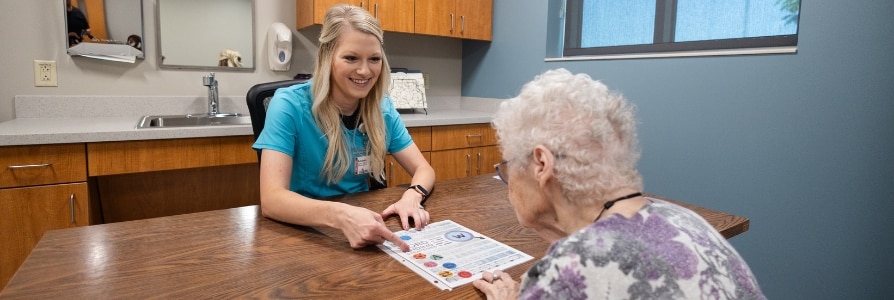 Speech therapist, Amanda, working with a patient.