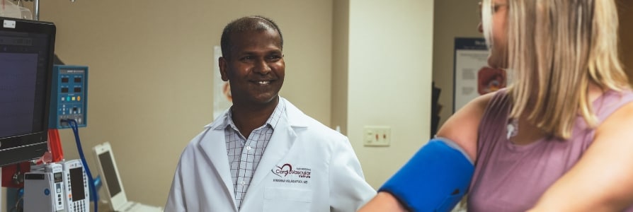 Dr. Velagapudi, a cardiologist, performing a stress test.