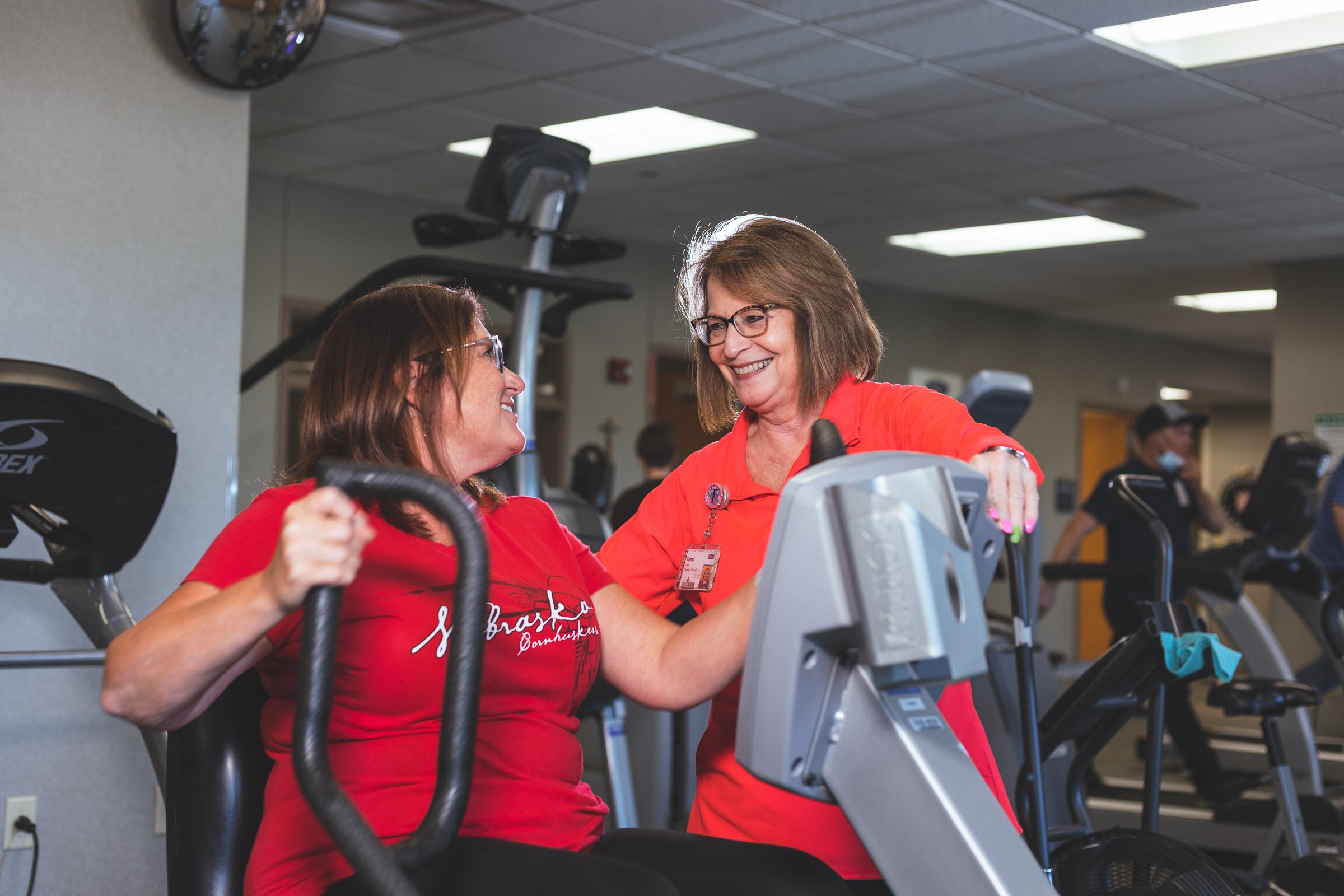 An LPN working with a cardiac rehab patient.