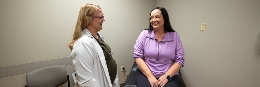 A palliative care provider with a patient.