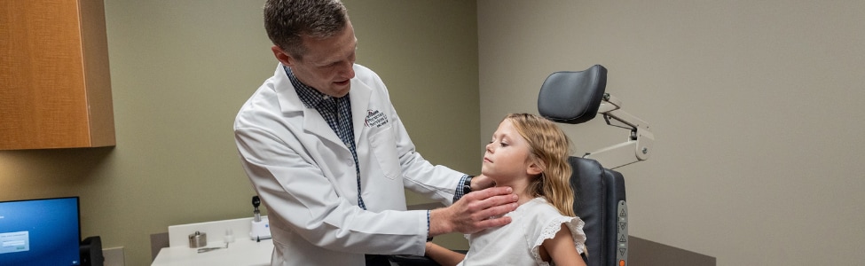 Dr. Rohe with young patient