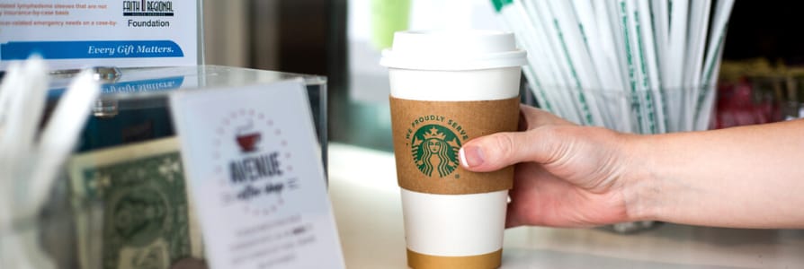 person grabbing a coffee