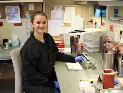 A medical technologist performing tests.