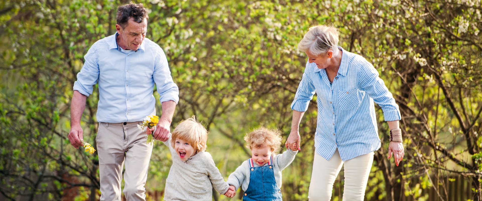 Grandparents walking with their grandchildren.