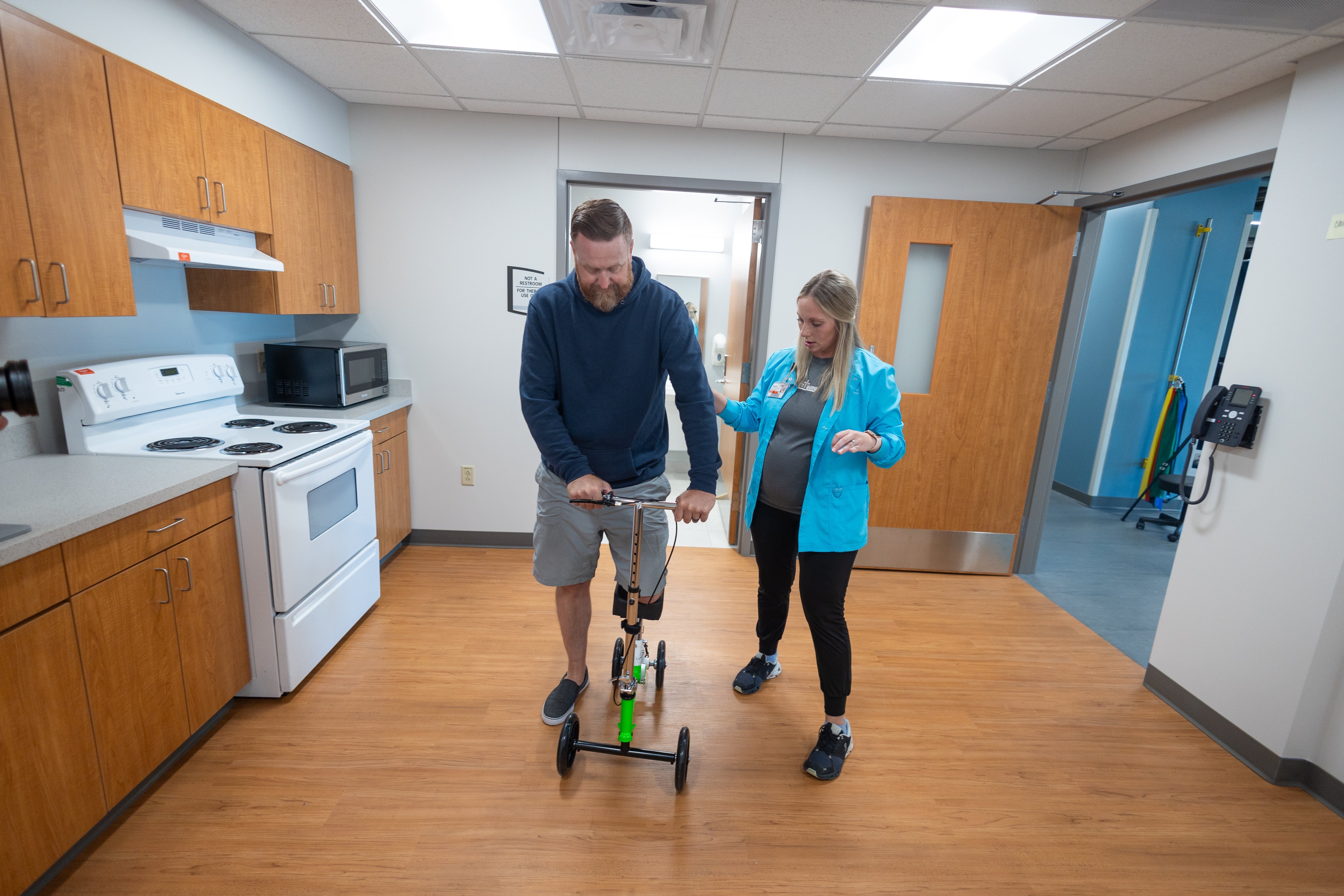 An occupational therapist working with a patient.