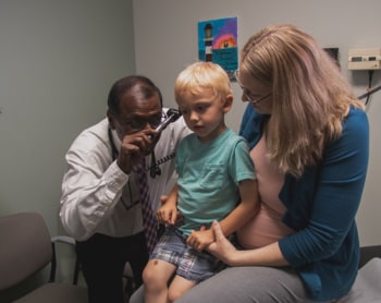 Dr. Lane Handke examining a patient.