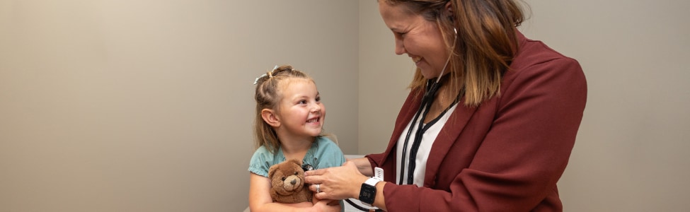 A child being examined by a pediatrics provider.