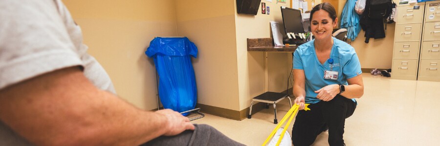 Physical therapist working with a patient.